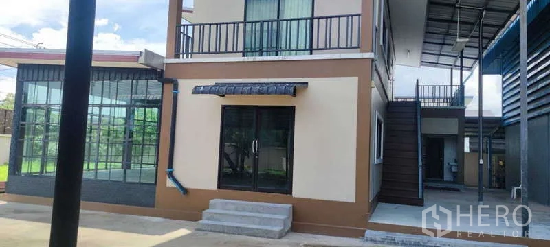 Warehouse for sale in Thung Khru, Bangkok - Close view of office entrance with sliding doors and external staircase.