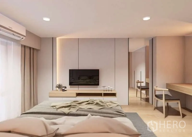 Condominium for rent in Huai Khwang, Bangkok - Bedroom wall with TV console, ambient lighting and sliding curtains.