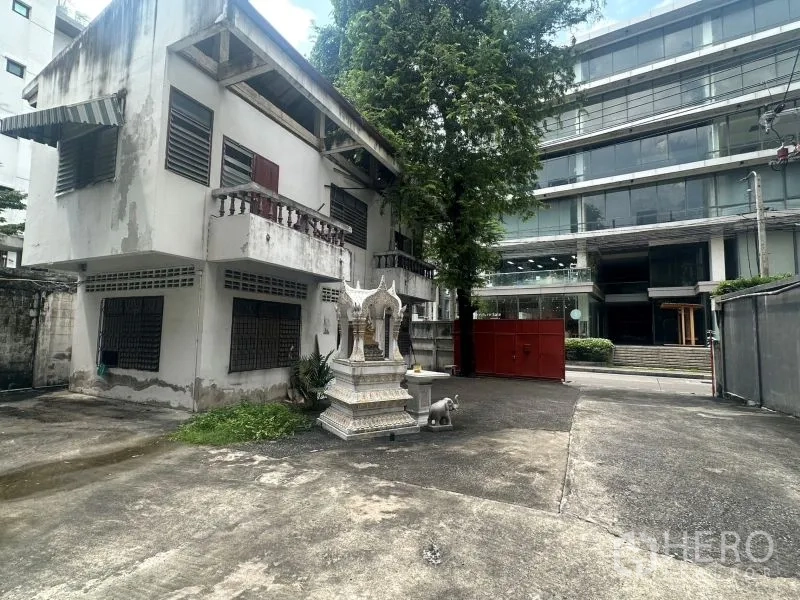 Office Space for rent - Annex building in courtyard facing modern offices beyond gated boundary