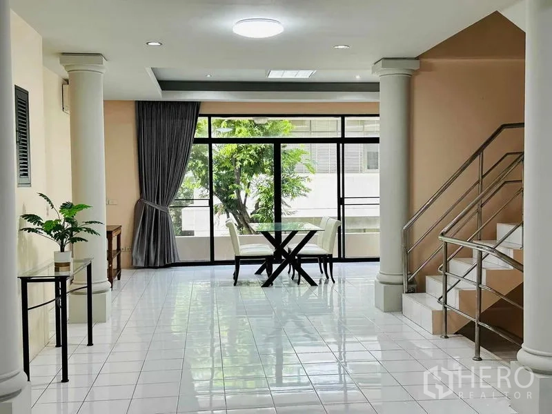 Home Office for rent - Bright dining corner by floor-to-ceiling windows, columns and stainless stairs.