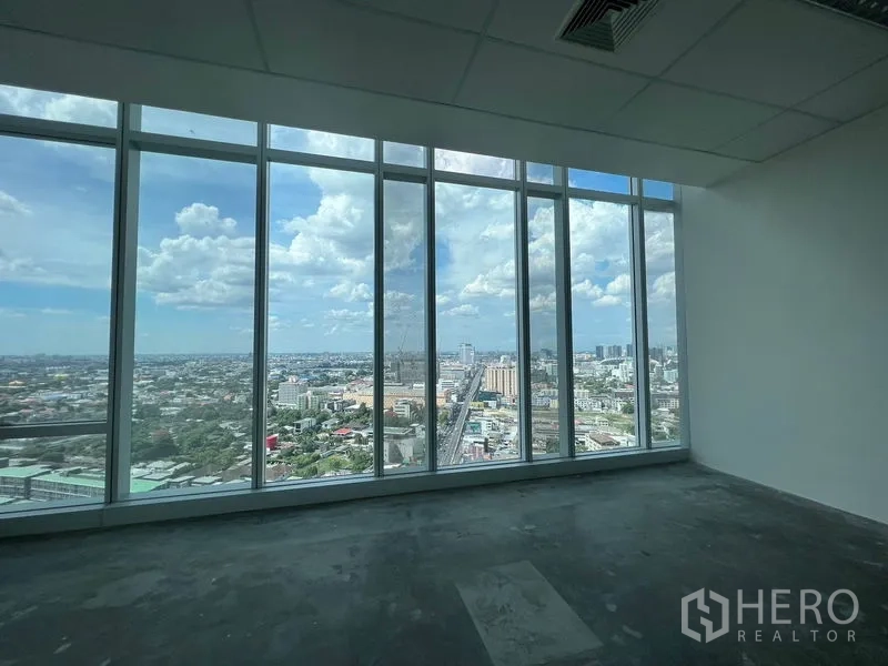 Office Space for rent - Window bay facing the urban corridor with far-reaching metropolitan views.