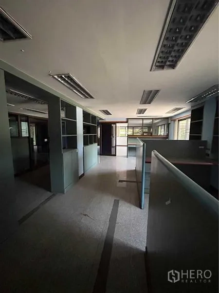 Warehouse for rent in Sam Phran, Nakhon Pathom - Open-plan office with workstations, overhead fluorescent lighting and window views.