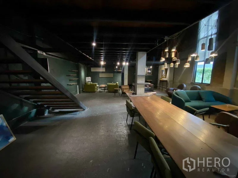 Retail Space for rent in Bang Na, Bangkok - Spacious hall with a long communal table and feature pendant lighting