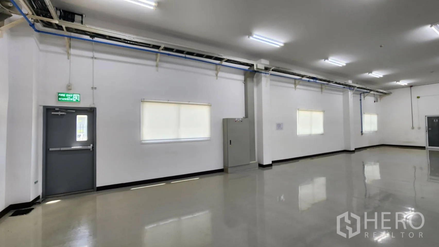 Factory for sale in Bang Bo, Samut Prakan - Small office room with observation windows overlooking the factory floor.