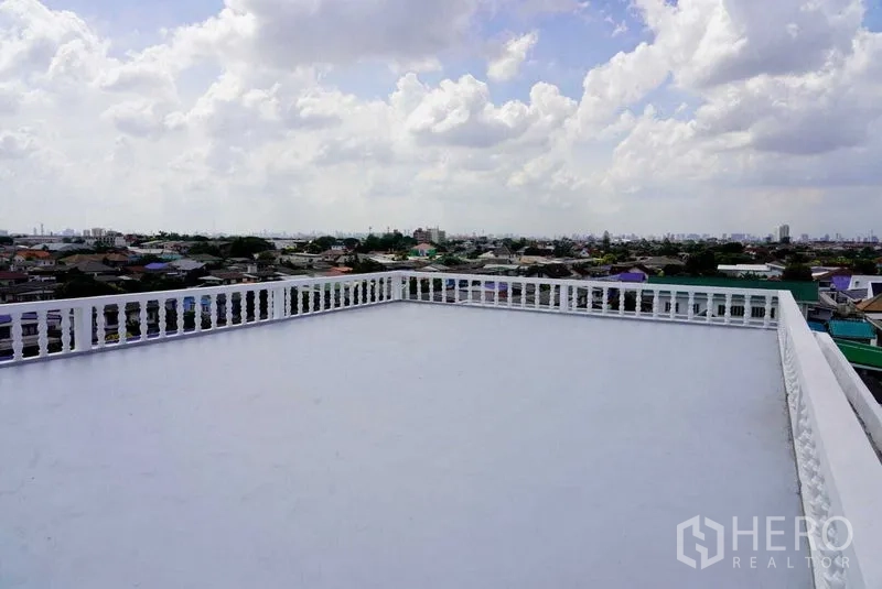 Office Space for sale in Khan Na Yao, Bangkok - Large rooftop terrace with balustrade offering wide city skyline views.