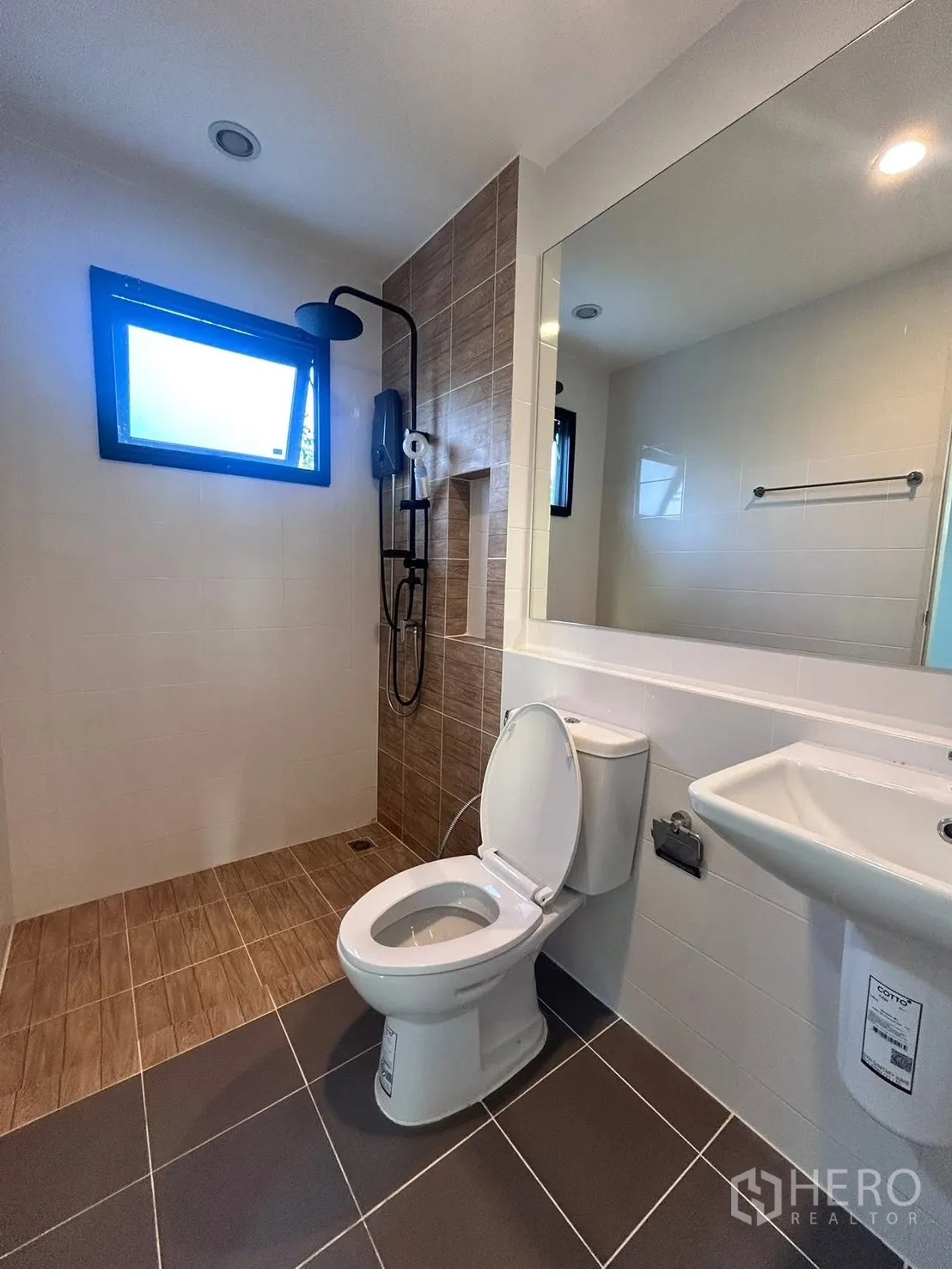 Semi-detached House for rent in Bang Phli, Samut Prakan - Modern bathroom with rain shower, small window, toilet, and pedestal sink.