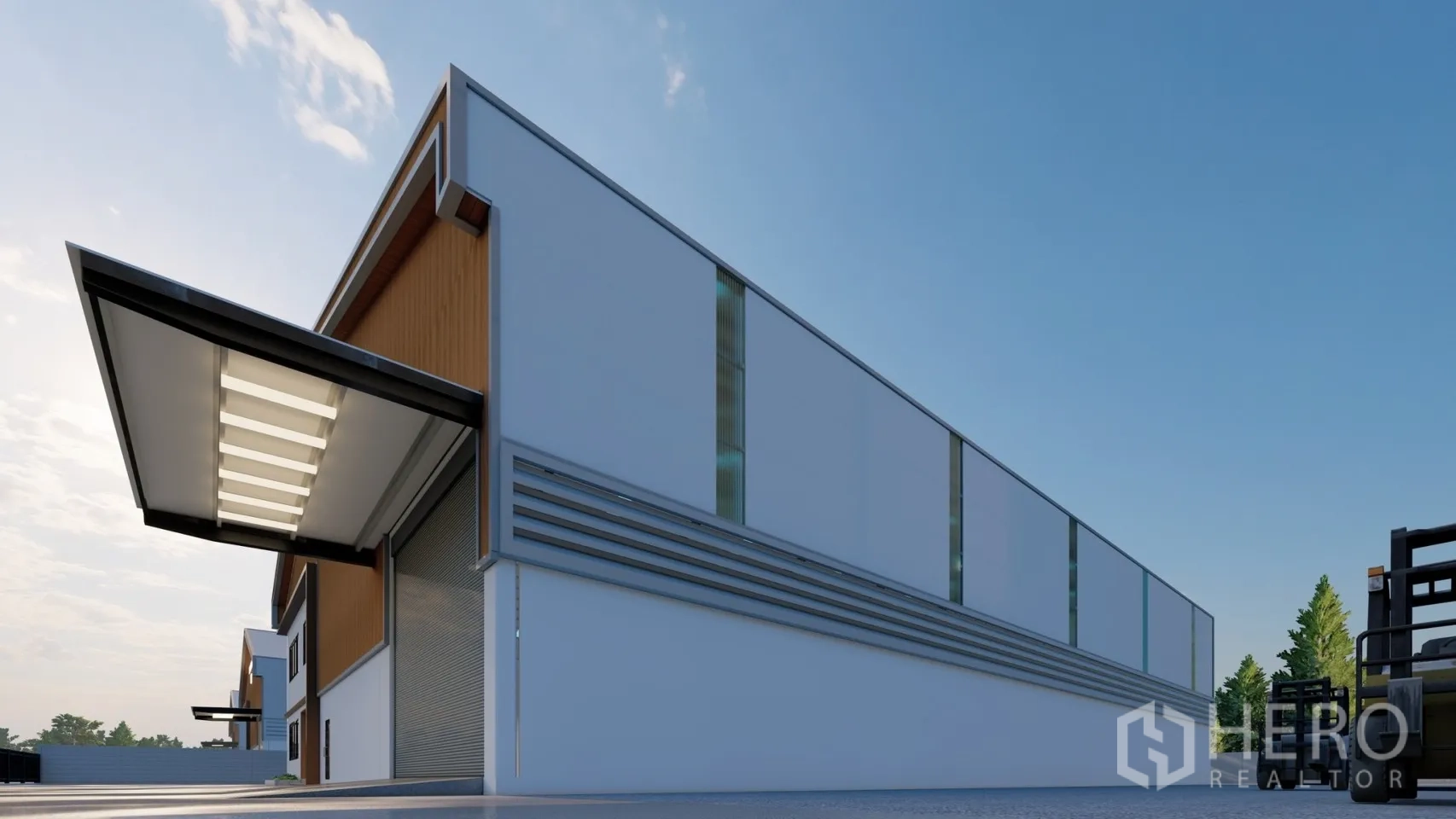 Factory for rent or sale in Lam Luk Ka, Pathum Thani - Side facade with long wall panels, skylight strips, and canopied loading area.