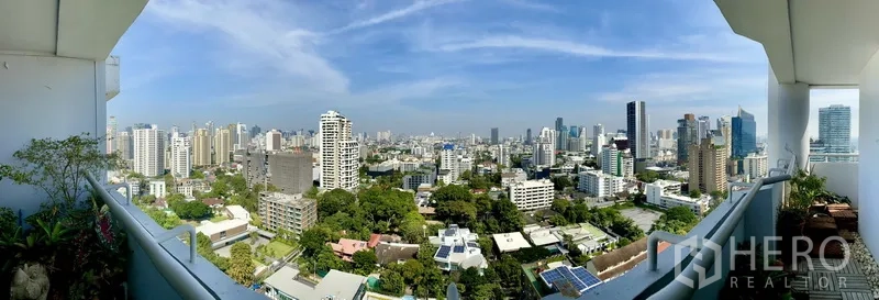Condominium for rent or sale in Watthana, Bangkok - High-floor balcony with panoramic Bangkok skyline and greenery views.
