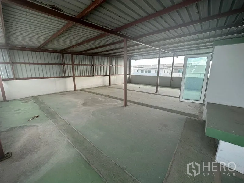 Home Office for rent in Bang Phli, Samut Prakan - Covered rooftop terrace with metal roof and city views.