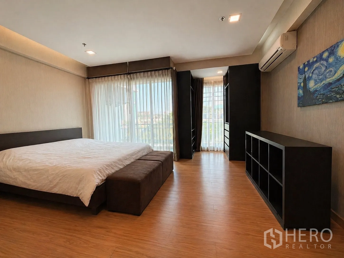 Home Office for rent or sale in Yan Nawa, Bangkok - Large bedroom with double bed, full-height windows, and built-in wardrobes.