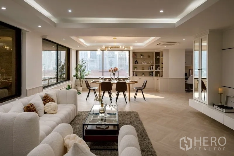 Condominium for sale - Open-plan living and dining with large windows overlooking the skyline.