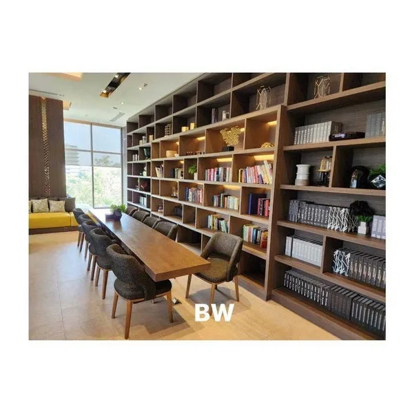 Condominium for rent in Phra Khanong, Bangkok - Library room with long table and built-in bookshelves filled with books