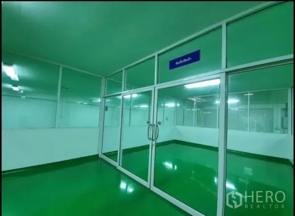 Factory for sale in Chon Buri - Glass-walled room with double doors inside the production area