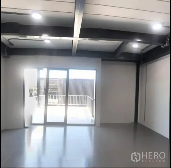 Office Space for rent in Wang Thonglang, Bangkok - Open-plan office room with tiled floor, downlights and sliding glass doors to a terrace.