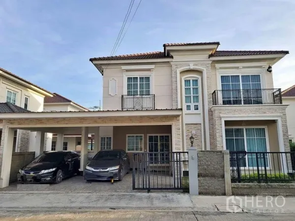 Detached House for sale in Bueng Kum, Bangkok - Two-storey detached house facade with gated carport for two cars.
