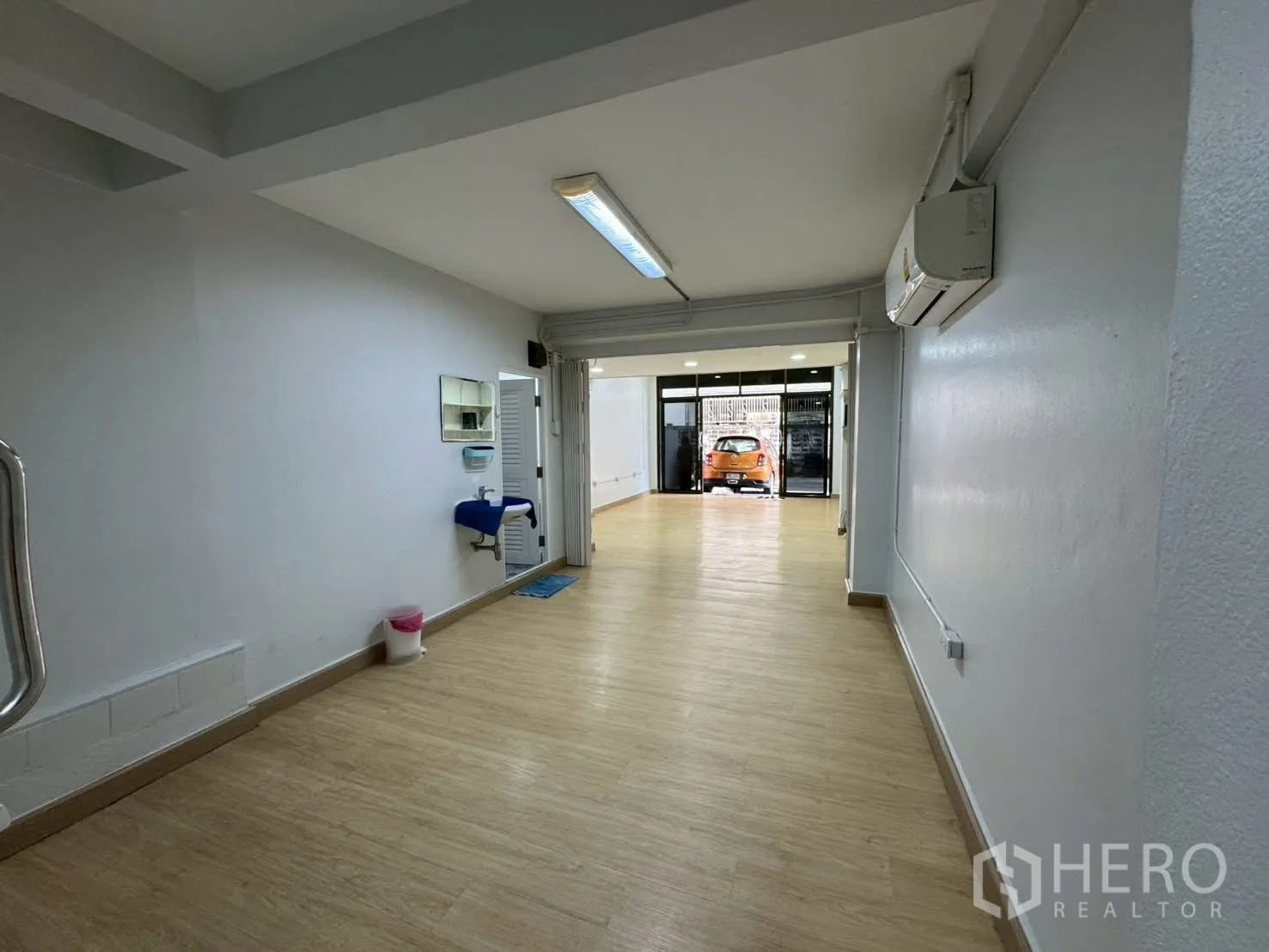 Home Office for rent in Sathon, Bangkok - View toward the front entry with glass doors and parking outside.