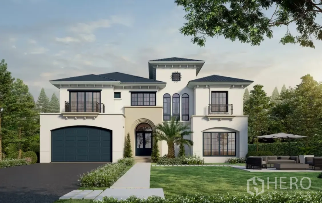 Detached House for rent in Lam Luk Ka, Pathum Thani - Elegant white detached house with central arched entrance, tall windows, dark garage door, and palm-accented lawn.