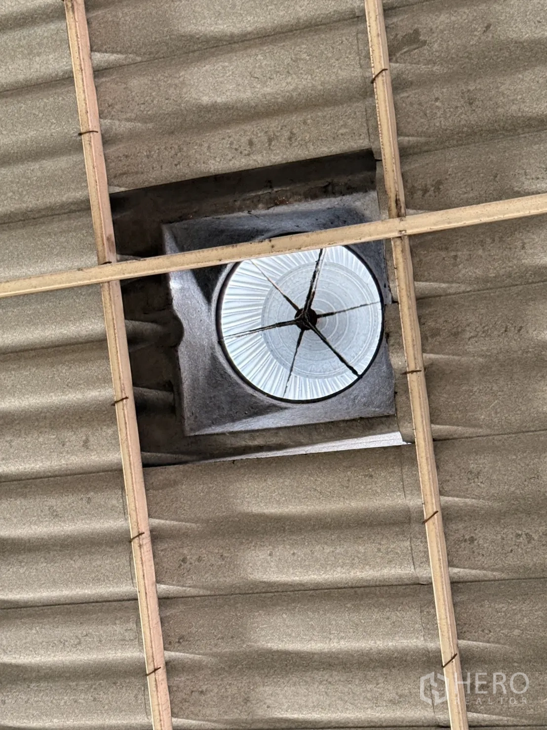 Warehouse for rent in Lam Luk Ka, Pathum Thani - Close-up of a roof turbine ventilator installed for heat extraction.