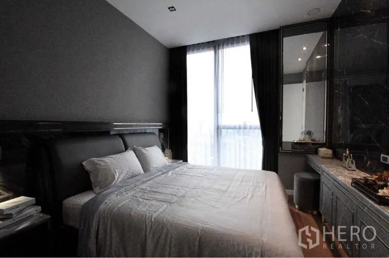 Condominium for rent in Bangkok - Stylish 1-bedroom condo bedroom with upholstered bed, floor-to-ceiling window and dark tones in Bang Kho Laem, Bangkok.