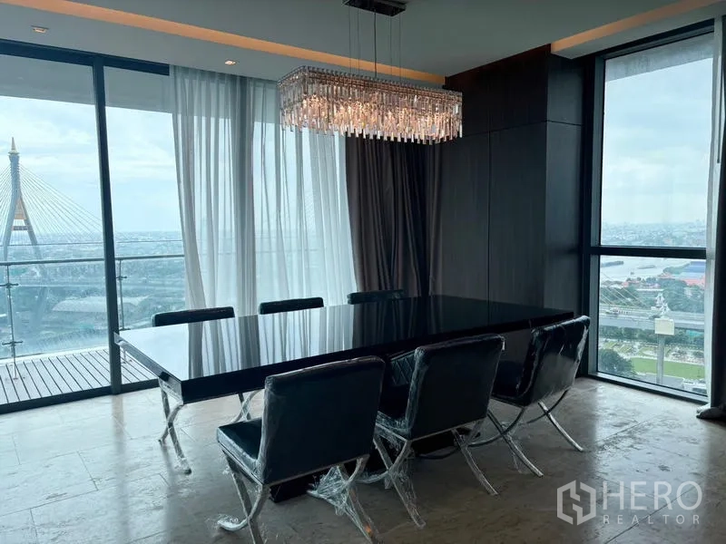 Condominium for rent - Dining area with crystal chandelier, large table and panoramic river outlook.