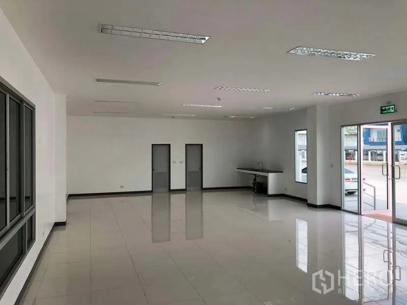 Factory for rent in Bang Sao Thong, Samut Prakan - Bright tiled office lobby with large windows and glass double doors.