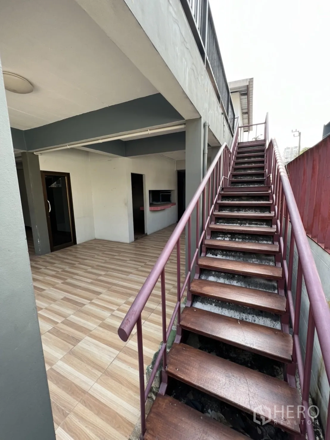 Home Office for rent in Watthana, Bangkok - Close-up of outdoor wooden staircase leading to the upper terrace.