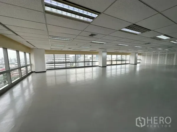 Office Space for rent - Bright corner office space with panoramic Bangkok skyline through wide windows.