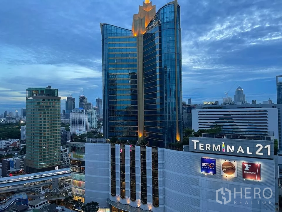 Condominium for rent in Watthana, Bangkok - Evening view of Terminal 21 mall and nearby office towers from the condo.