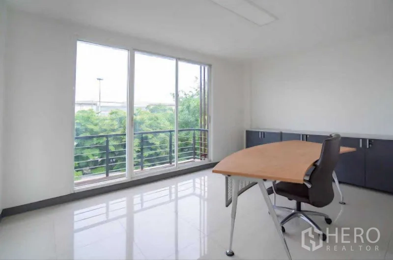 Home Office for rent or sale in Lat Krabang, Bangkok - Executive office with floor-to-ceiling windows, balcony and greenery view.