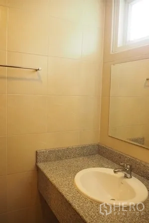 Condominium for rent in Pathum Wan, Bangkok - Bathroom vanity with granite countertop, sink and large mirror