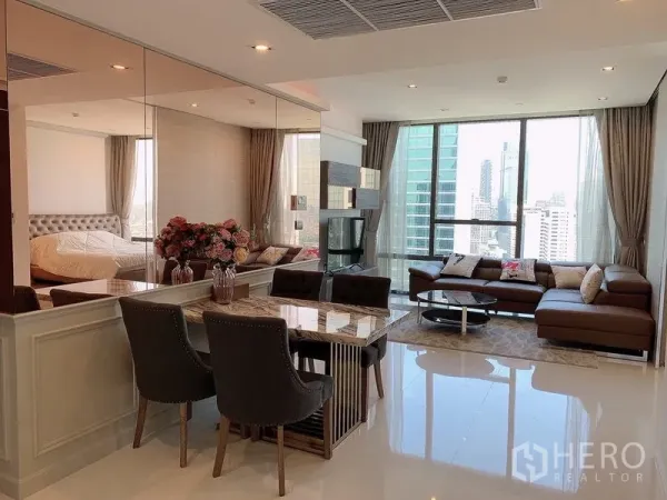 Condominium for sale - Wide view of open-plan condo with dining, lounge, and city panorama.