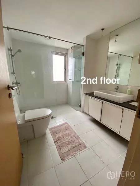 Home Office for rent or sale in Suan Luang, Bangkok - Second‑floor bathroom featuring a glass shower enclosure, vanity and large mirror.