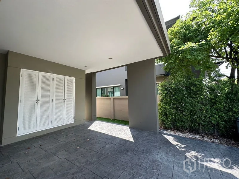 Detached House for rent or sale - Covered carport with storage closet and privacy hedges.