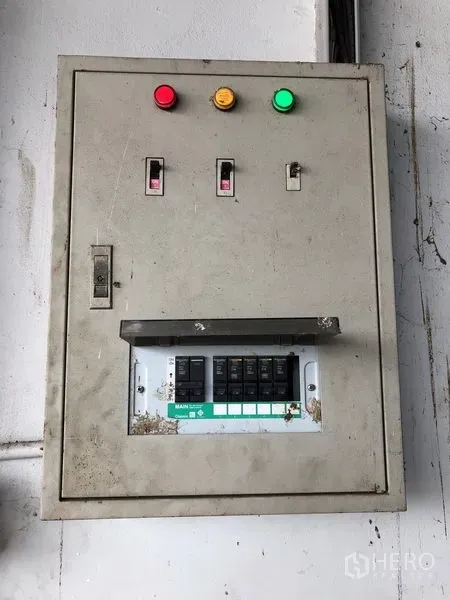 Warehouse for rent in Lat Lum Kaeo, Pathum Thani - Industrial electrical control panel and breaker box mounted on the warehouse wall.
