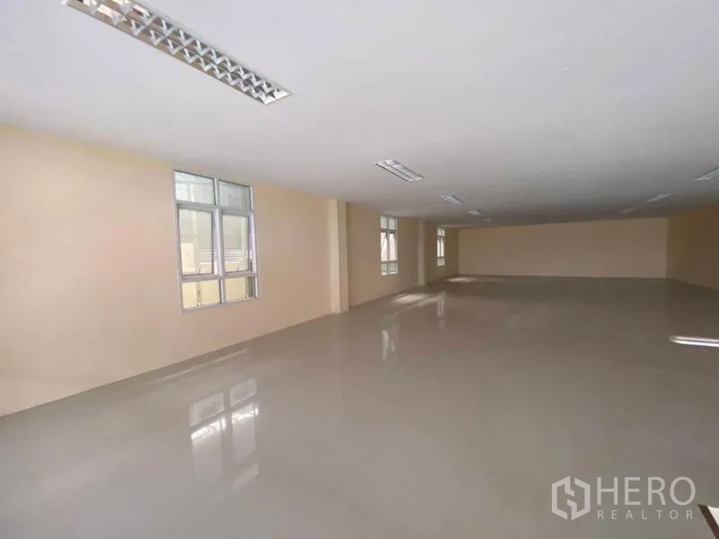 Factory for rent in Bang Phli, Samut Prakan - Bright upper-level office space with glossy tiled floor and fluorescent lighting.