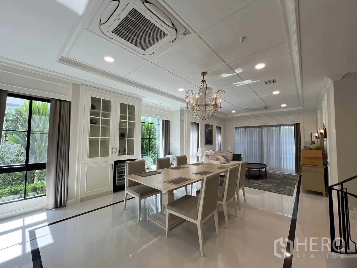 Detached House for rent in Saphan Sung, Bangkok - Open‑plan dining and living space with large windows and garden views.