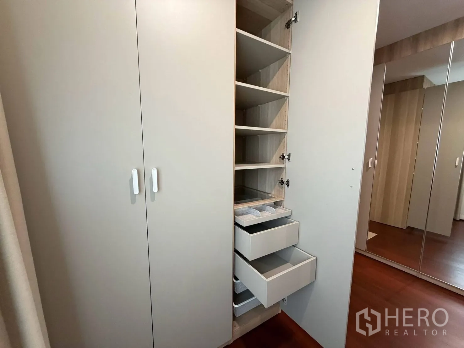 Detached House for rent in Suan Luang, Bangkok - Tall cabinet with shelves and drawers for bedroom storage.