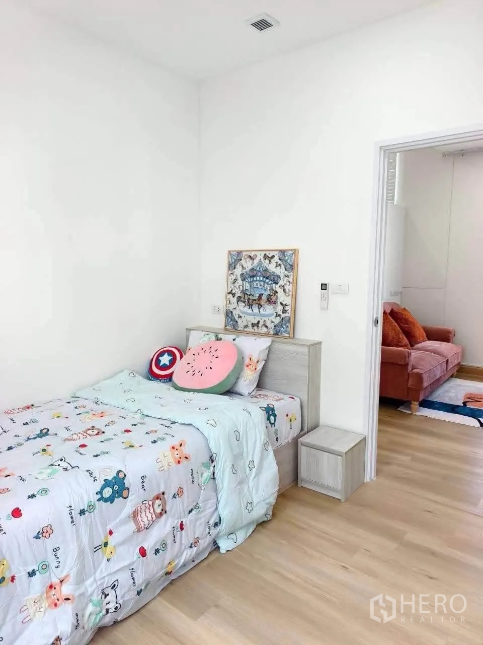 Detached House for rent in Bang Phli, Samut Prakan - Bright bedroom with a single bed, bedside table, and wood flooring opening to a cozy lounge.