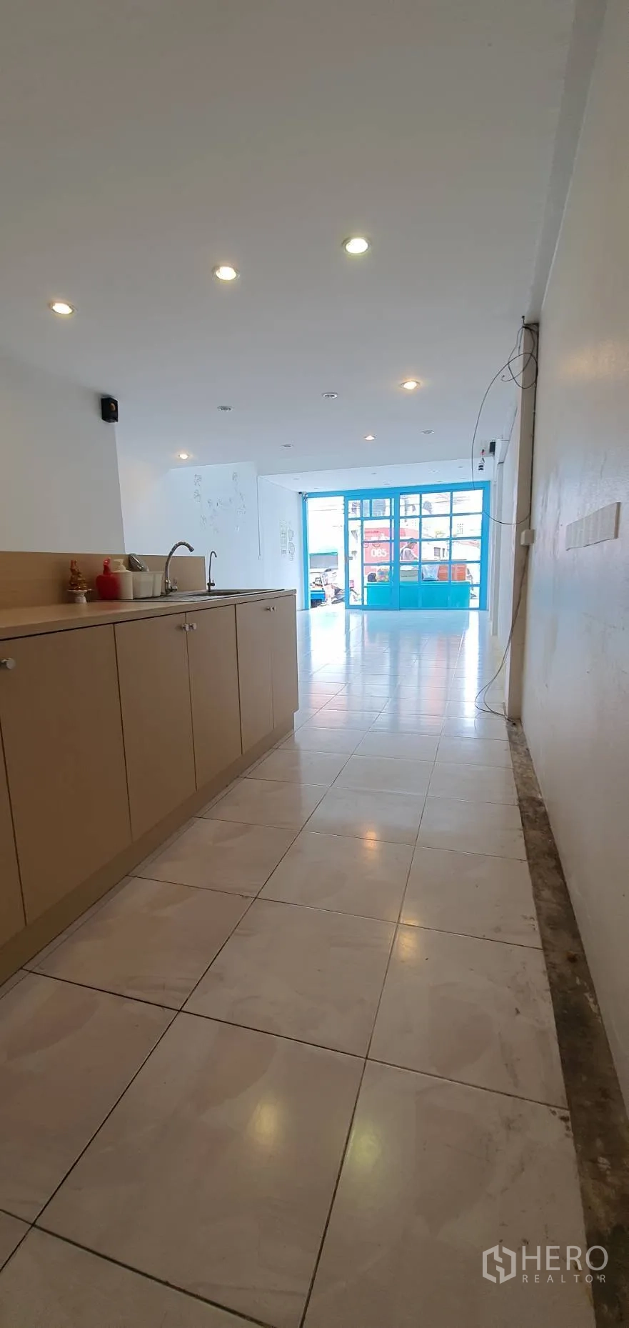 Home Office for rent in Khlong Toei, Bangkok - Front area with built-in counter and sink under recessed lights.