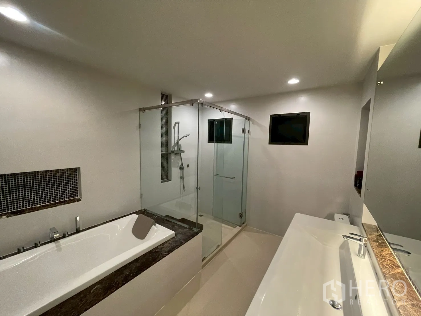 Detached House for rent in Bang Kapi, Bangkok - Master bathroom with bathtub, separate glass shower, and wide vanity.