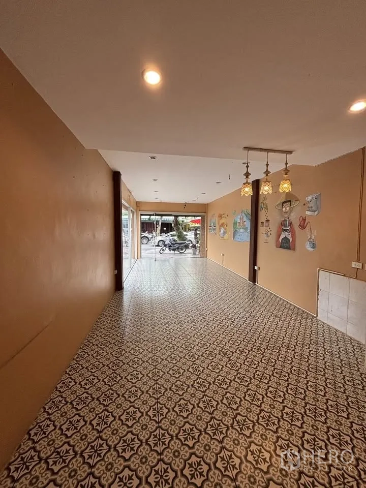 Retail Space for rent in Sathon, Bangkok - Long open-plan room with recessed ceiling lights and hanging lamps.