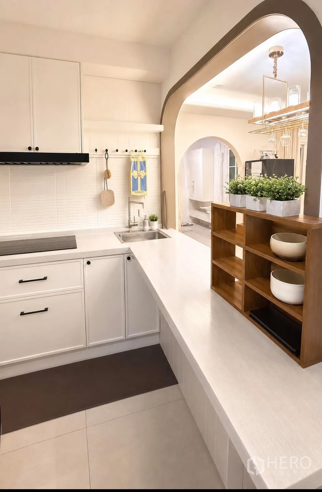 Detached House for rent or sale in Bang Phli, Samut Prakan - Kitchen counter with open shelving and an arched doorway to the dining area.