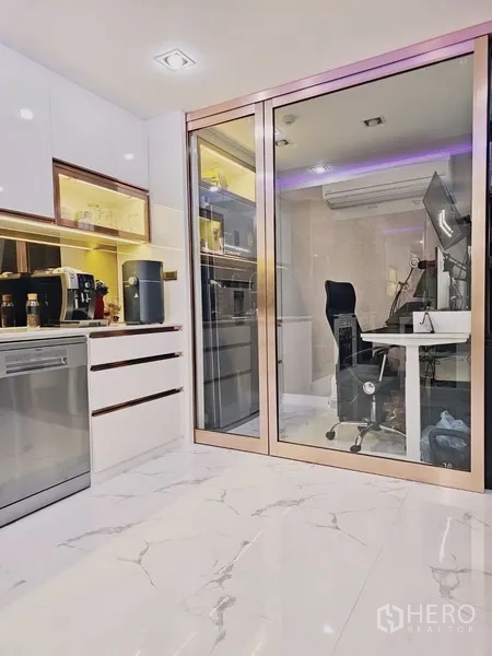 Condominium for sale in Bang Rak, Bangkok - Glass-partitioned home office off the kitchen with desk, monitor and air-conditioning.