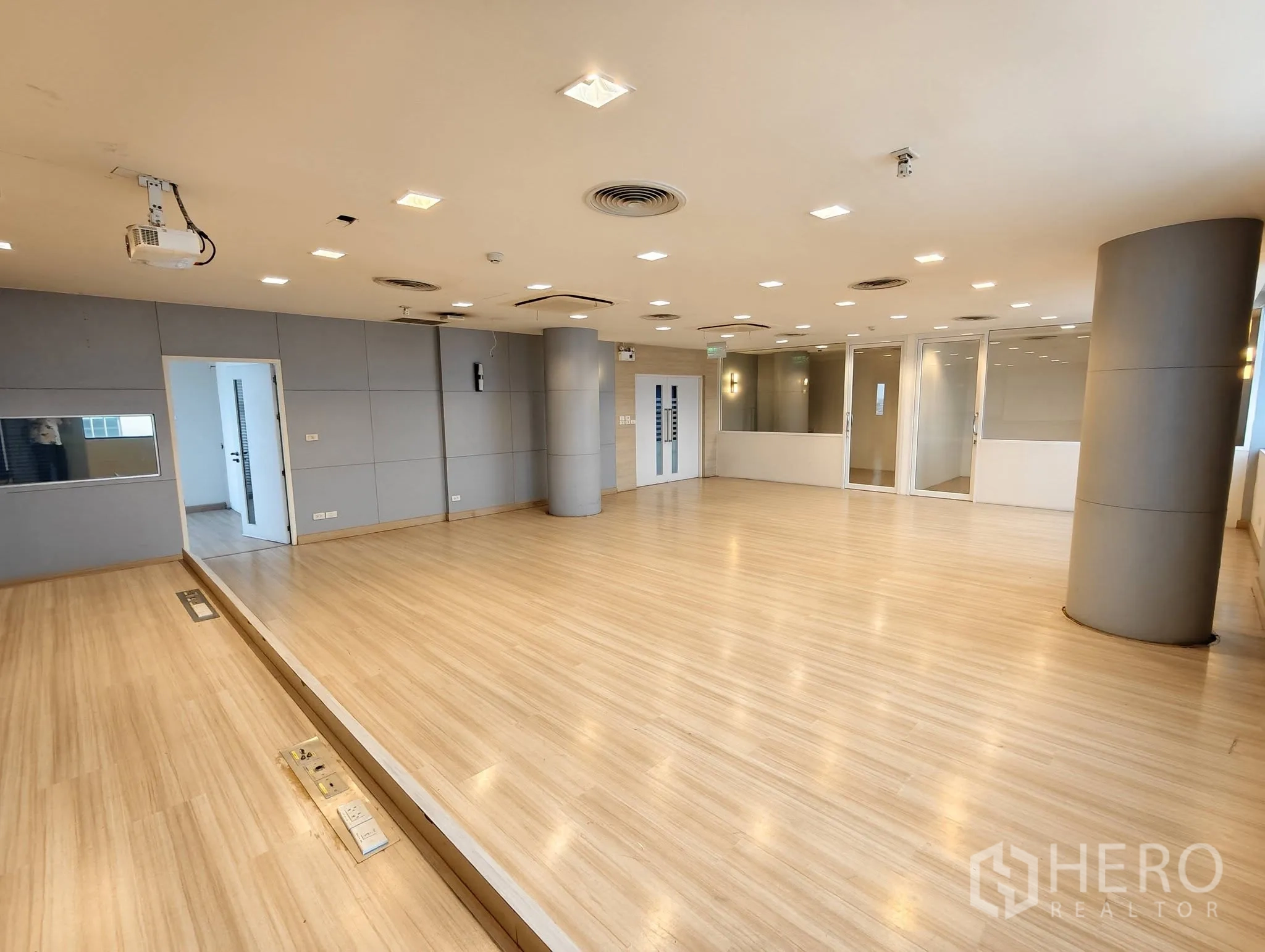 Office Space for rent in Lak Si, Bangkok - Training room with projector, stage platform, and round columns.