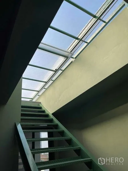 Home Office for rent in Phaya Thai, Bangkok - Skylit stairwell with a metal staircase and glass roof allowing daylight in.