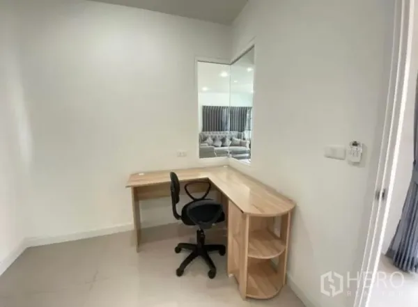 Detached House for rent or sale - Compact study nook featuring a corner wooden desk, swivel chair and wall mirror.