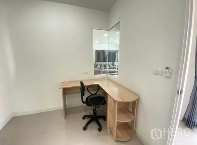 Detached House for rent or sale - Compact study nook featuring a corner wooden desk, swivel chair and wall mirror.