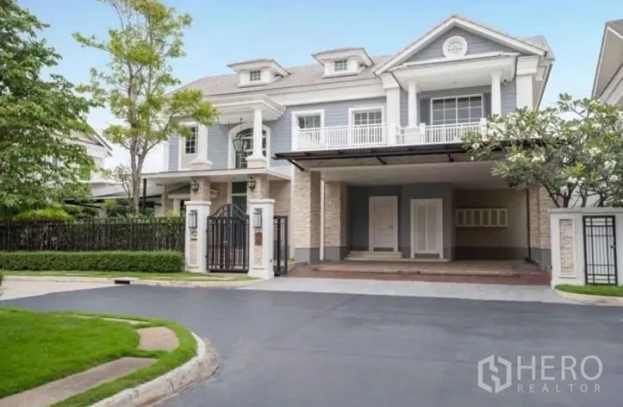 Detached House for rent or sale in Bang Phli, Samut Prakan - Elegant two-storey detached house facade with gated entrance and covered parking.