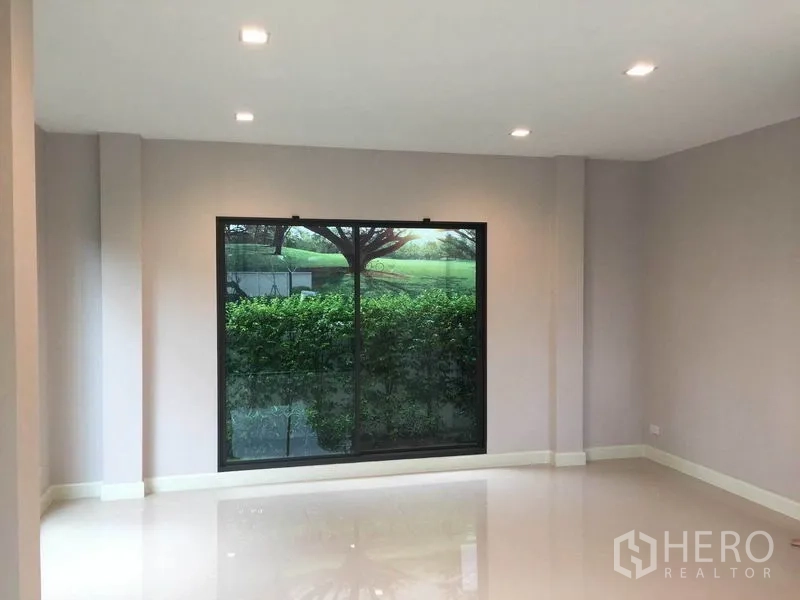 Detached House for sale in Pak Kret, Nonthaburi - Spacious room with big picture window and recessed ceiling lights