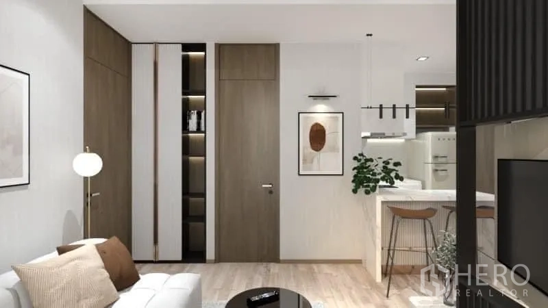 Condominium for rent in Watthana, Bangkok - View from living to kitchen with white island breakfast bar and bar stools.